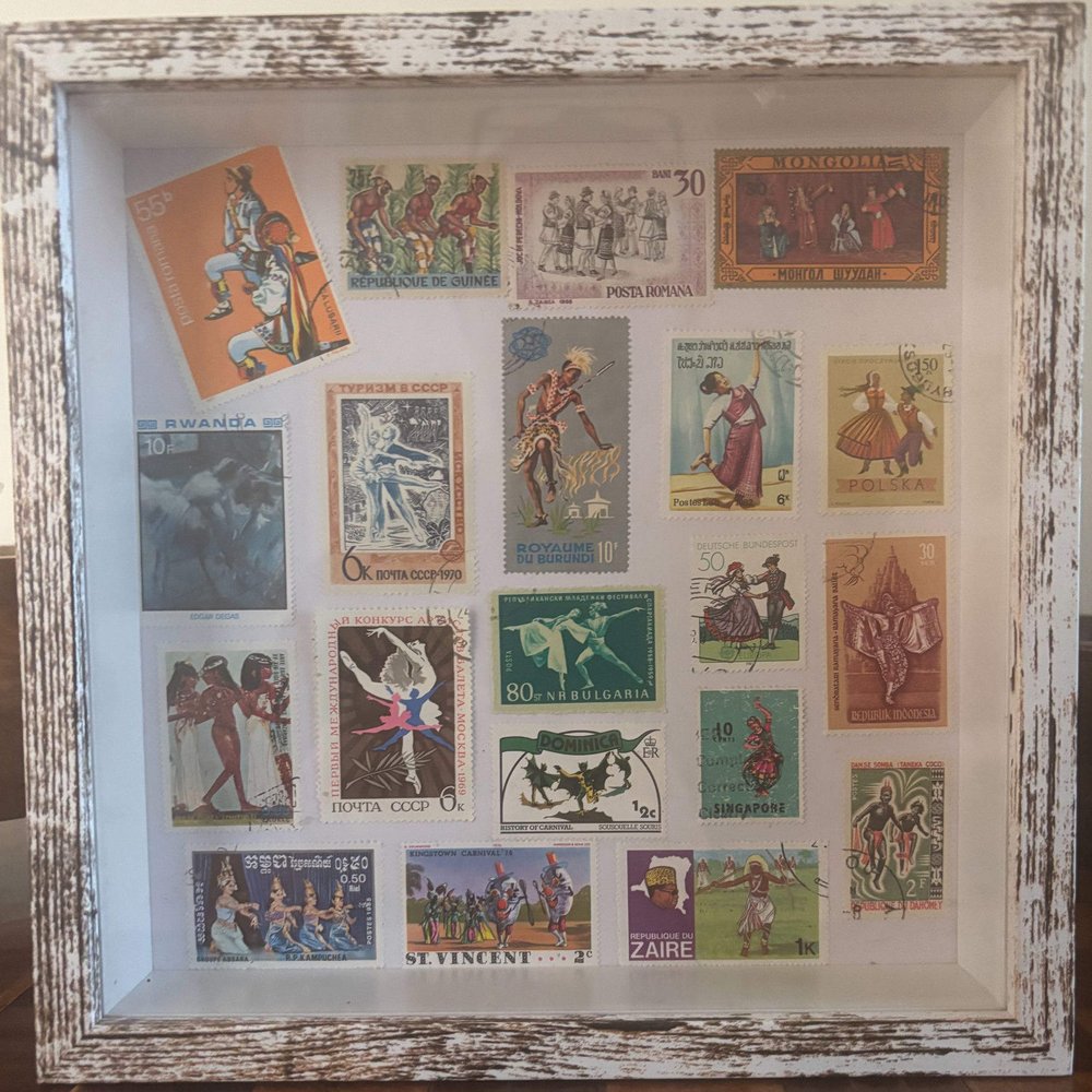 Let's Dance framed postage stamp art — ballet, folk and carnival dance stamps from around the world in a white 8x8 shadow box